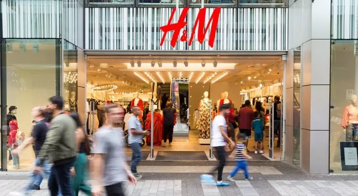 The front of an H&M store on a busy street